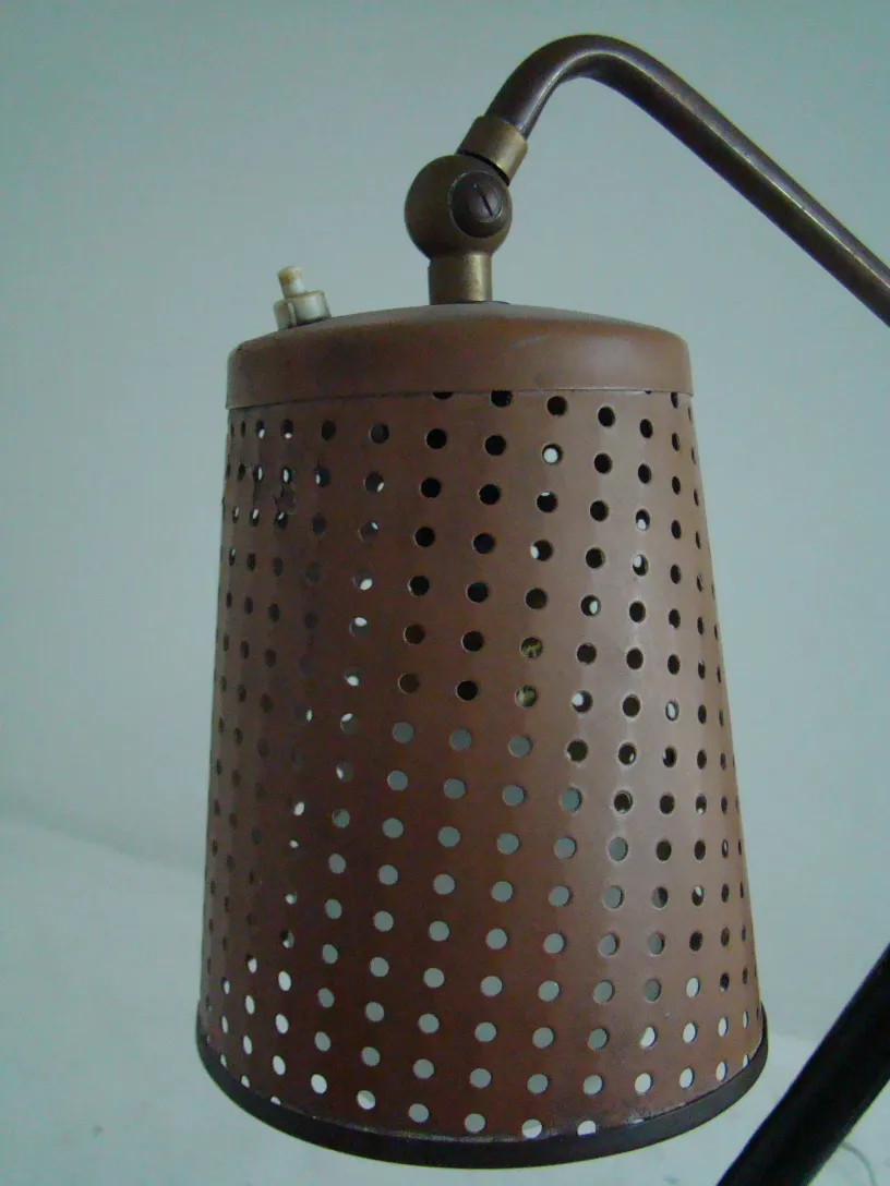 Antique floor lamp in art deco style with adjustable light in a modern setting.