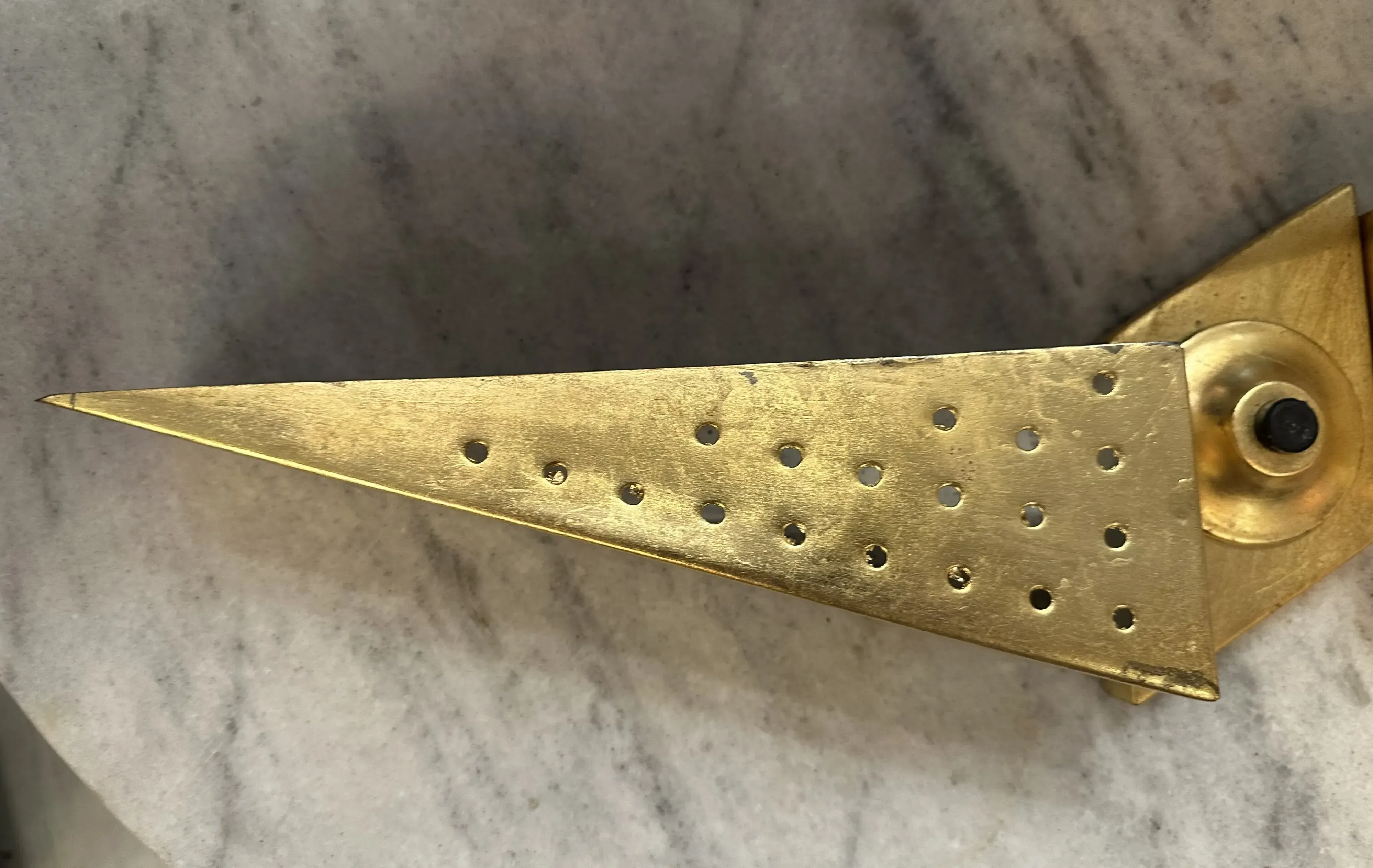 Antique wall sconce light with distinctive design and decorative holes