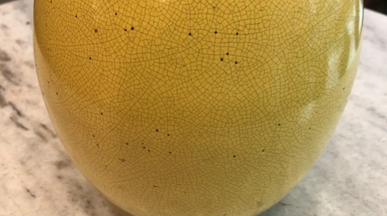 antique table lamp with yellow decor and cracks