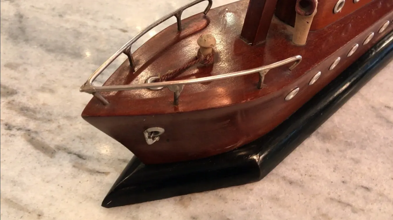 antique table lamp featuring nautical elements and warm colors