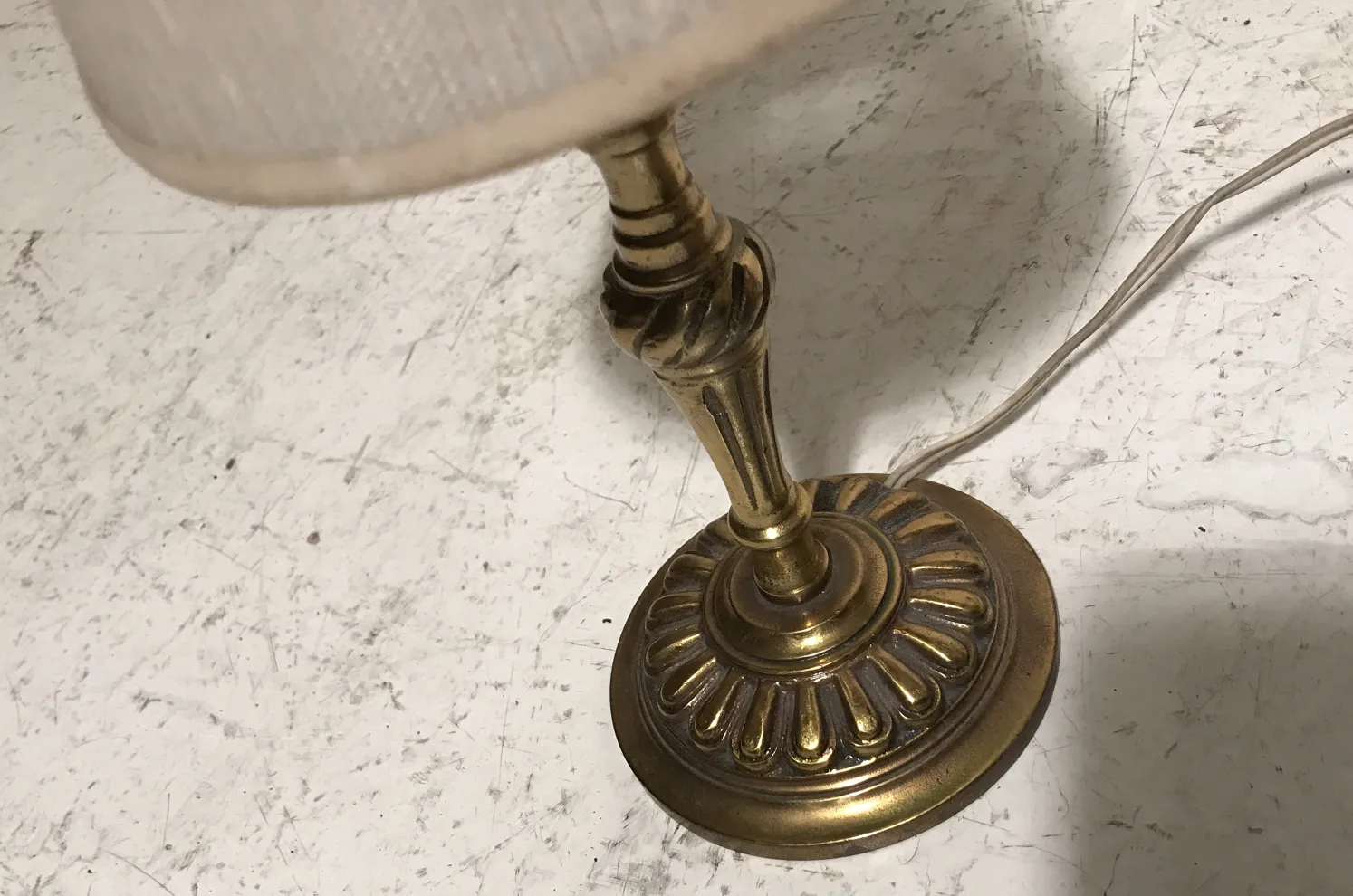 Antique table lamp in Art Deco style with decorative base.