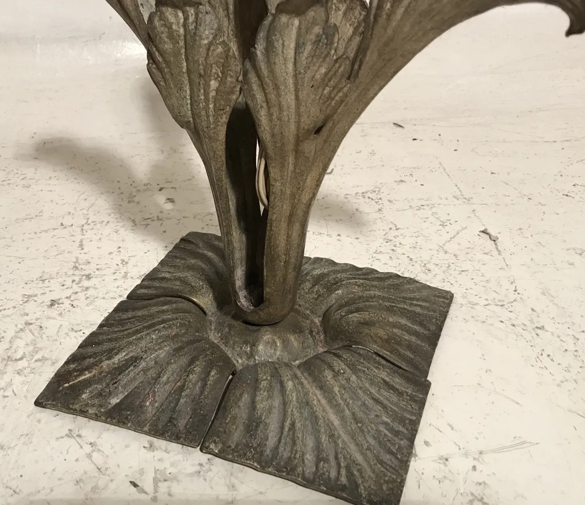 Antique table lamp in Art Deco style with decorative features.