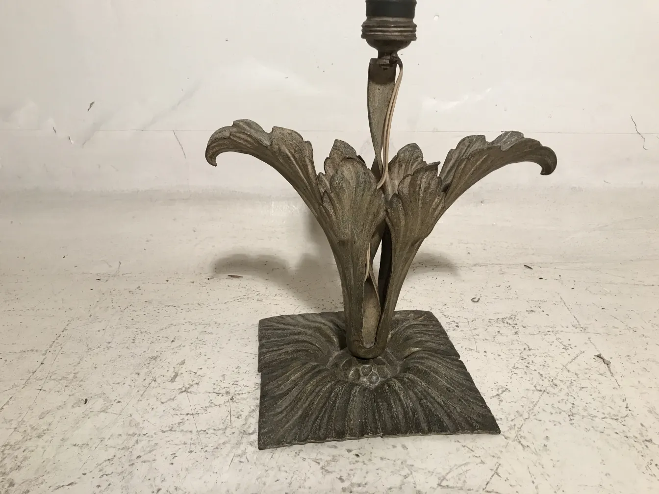 antique table lamp with a decorative leaf-shaped base