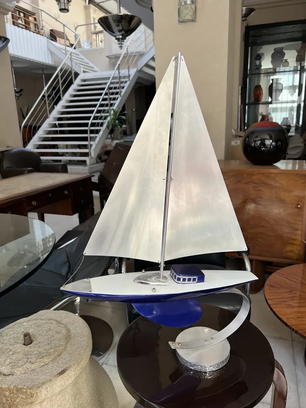 model of an antique ship with sails and ambient view