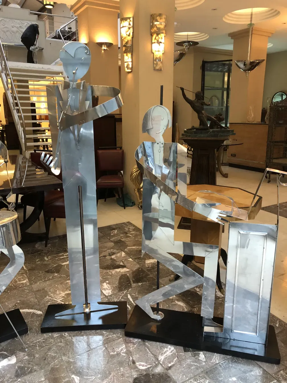 sculptures of the designer's music band in an antique setting