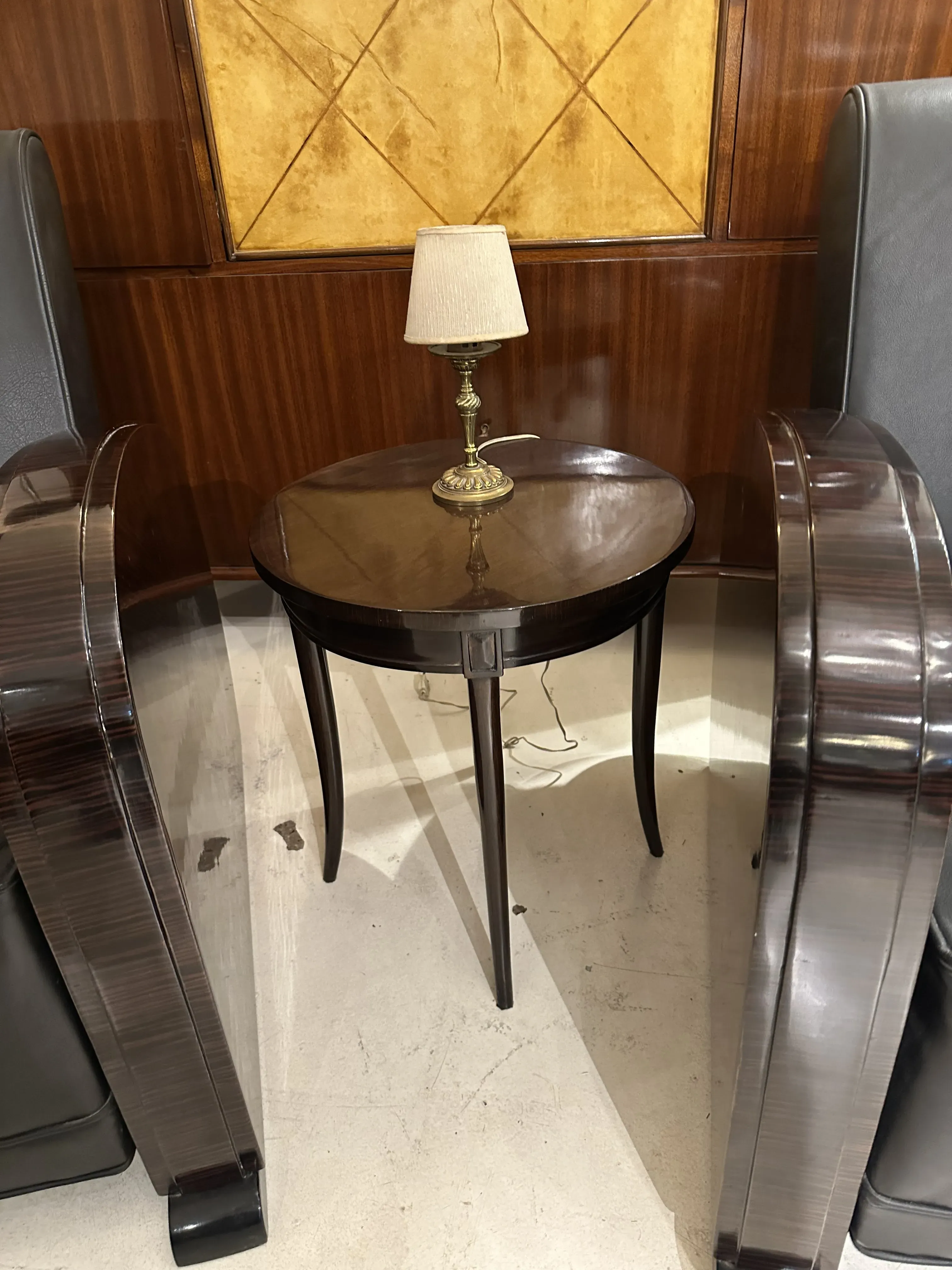 antique table lamp with white shade and golden base, in an elegant setting