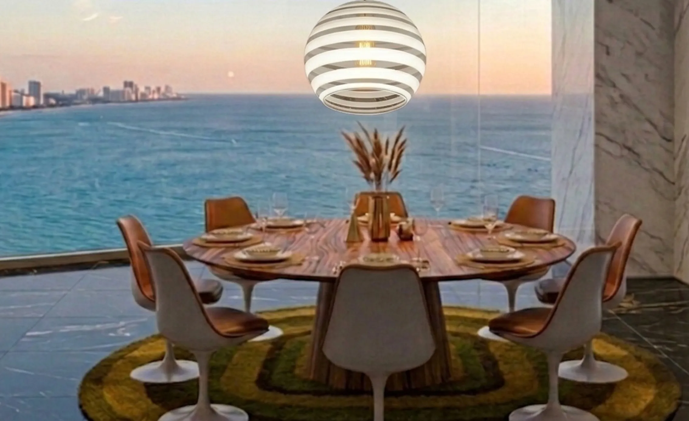 lustre ancien paolo venini au-dessus de la table avec vue sur la mer