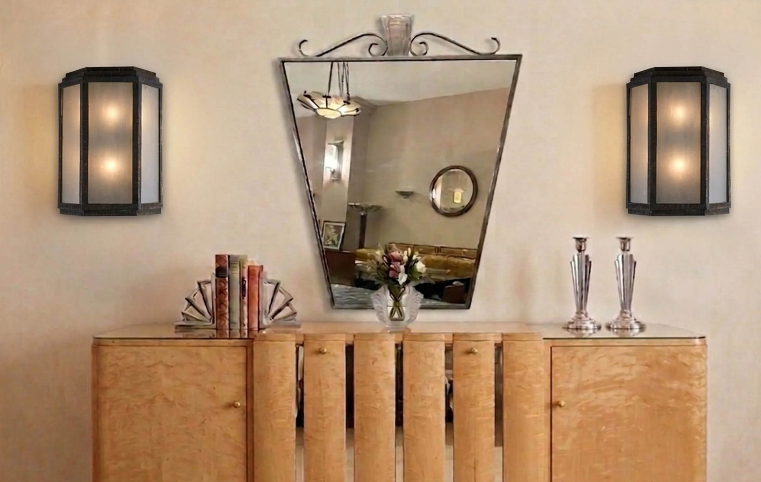 Pair of antique sconces with elegant design, illuminating a cozy ambiance.