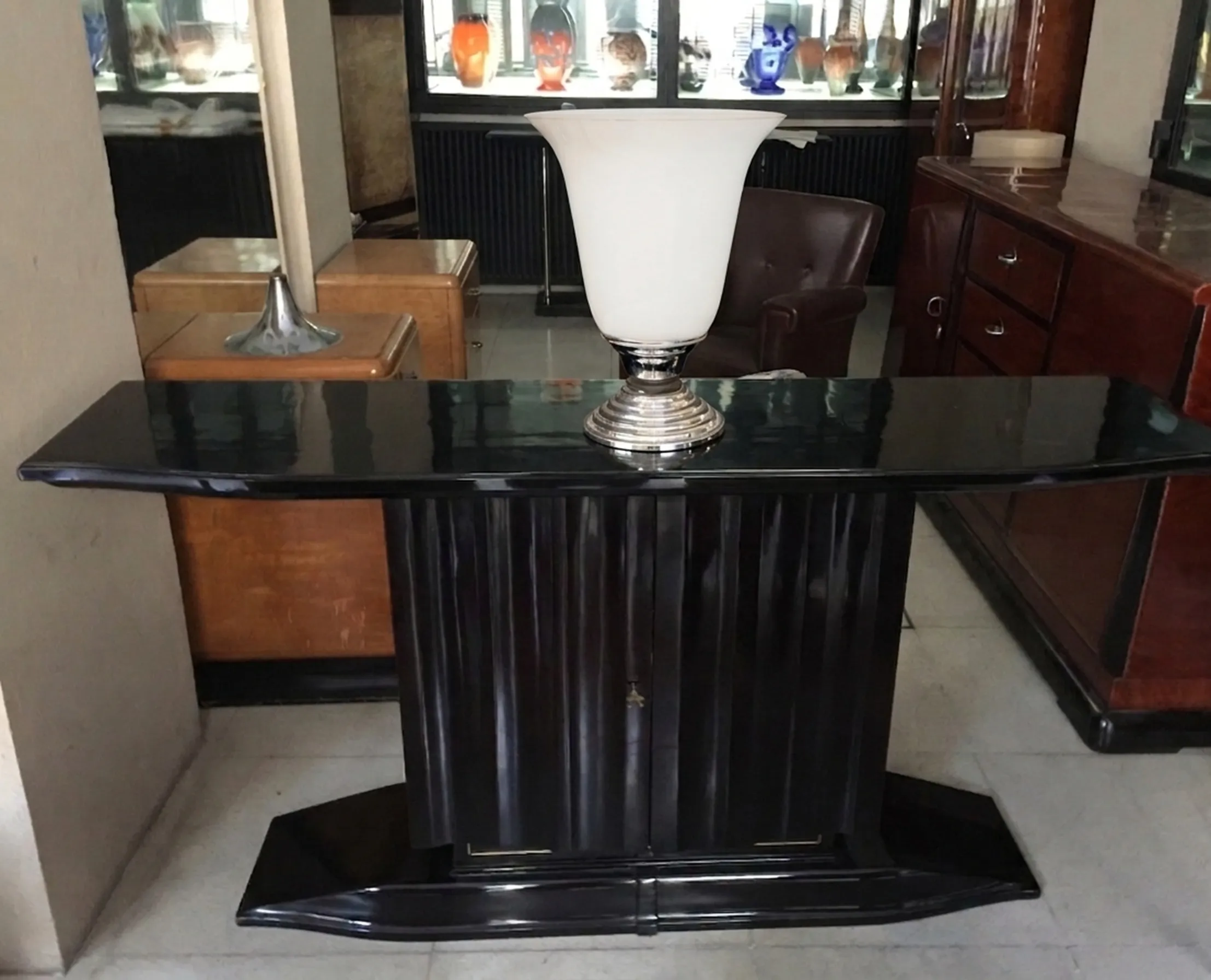 antique table lamp on a black table with decorative background