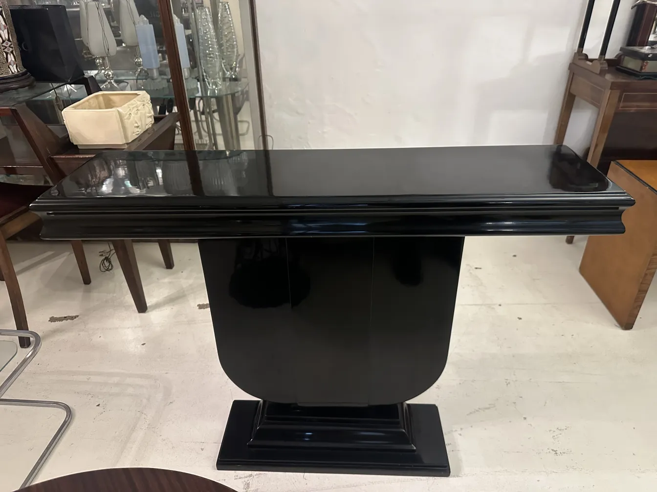 two antique consoles with elegant finish in a sophisticated environment