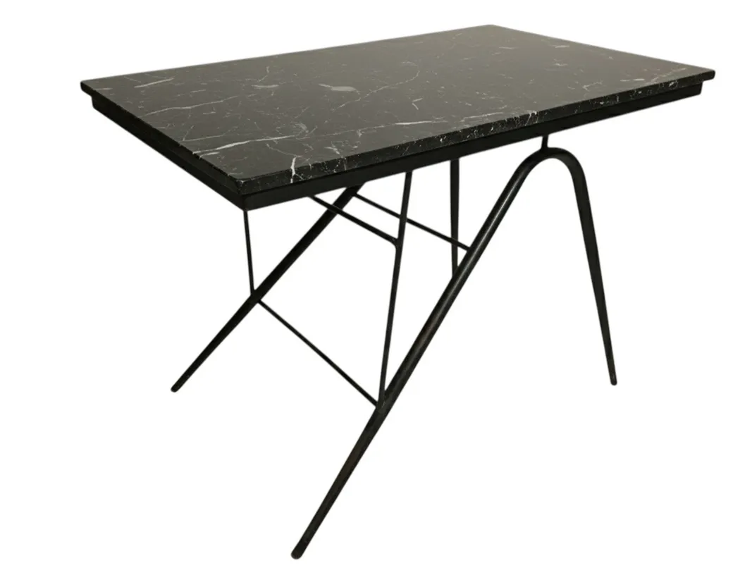 antique garden table featuring elegant design and unique legs