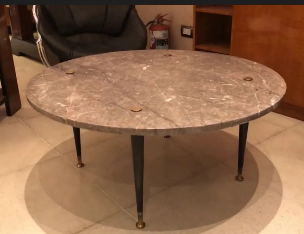 antique round coffee table with metal legs