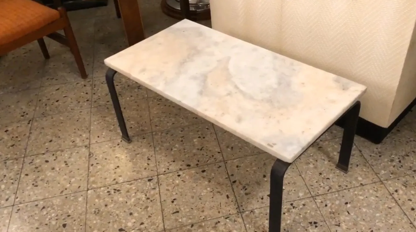 antique coffee table with a light surface in a cozy setting