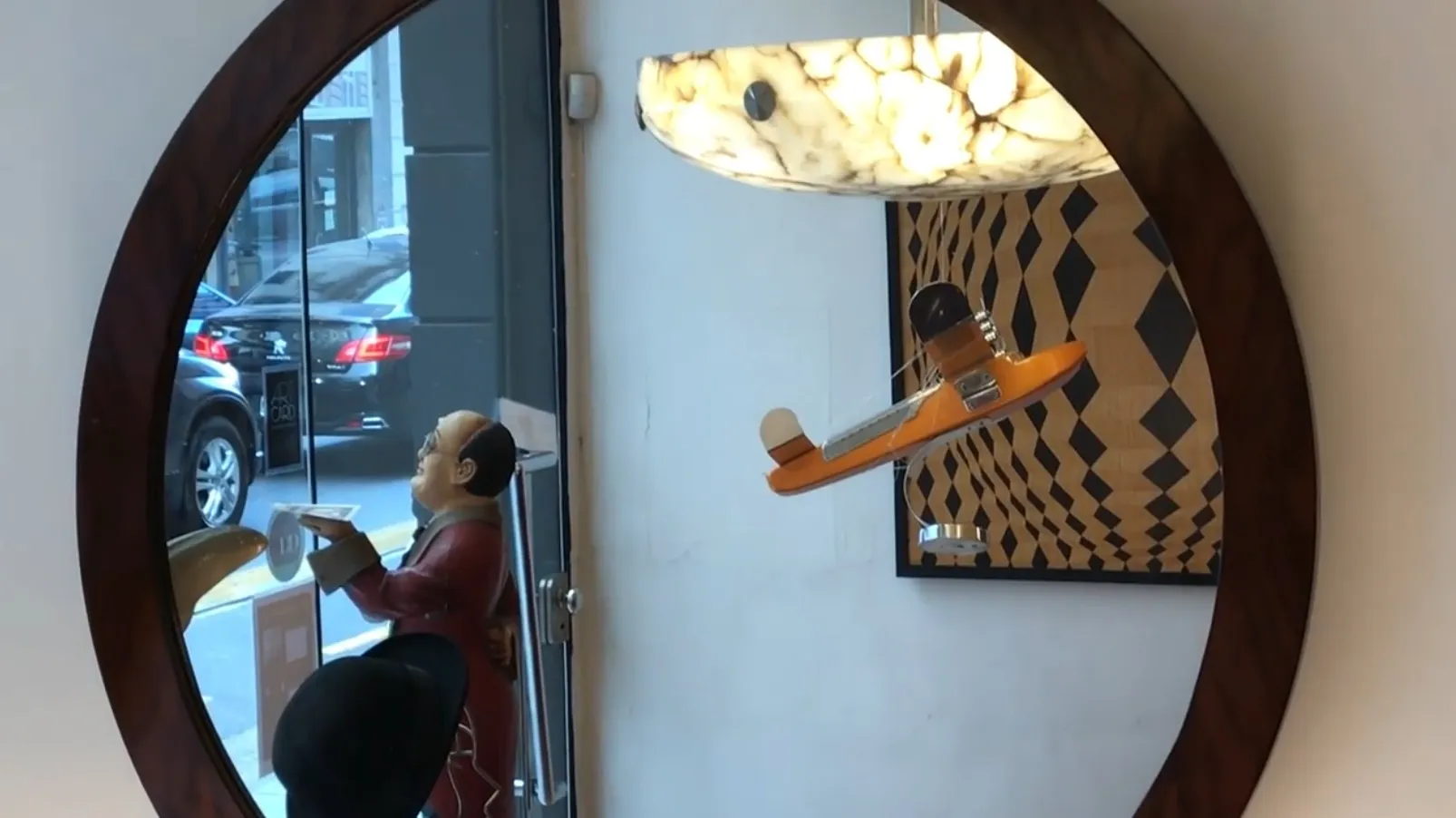 antique mirror reflecting urban scene