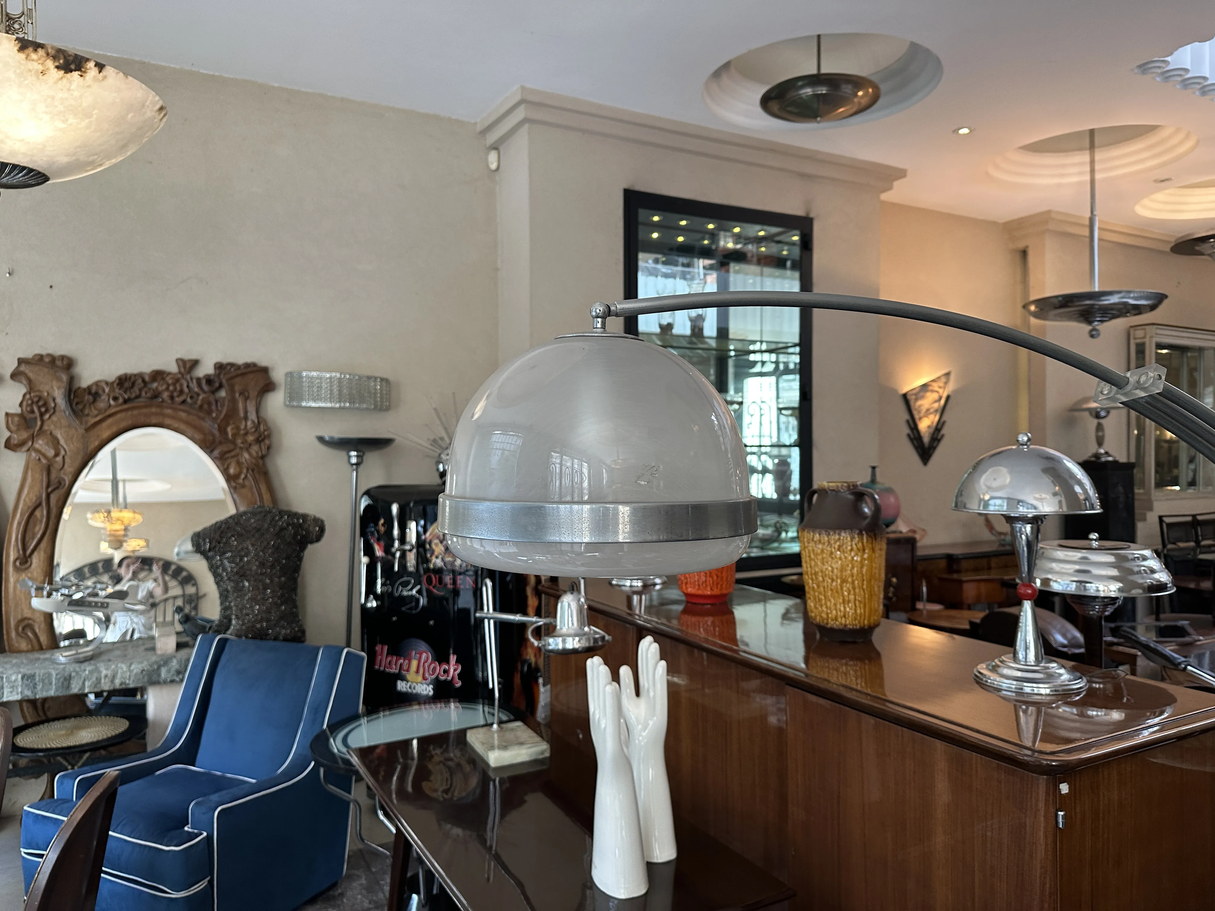 Antique floor lamp with spherical design in elegant living room.