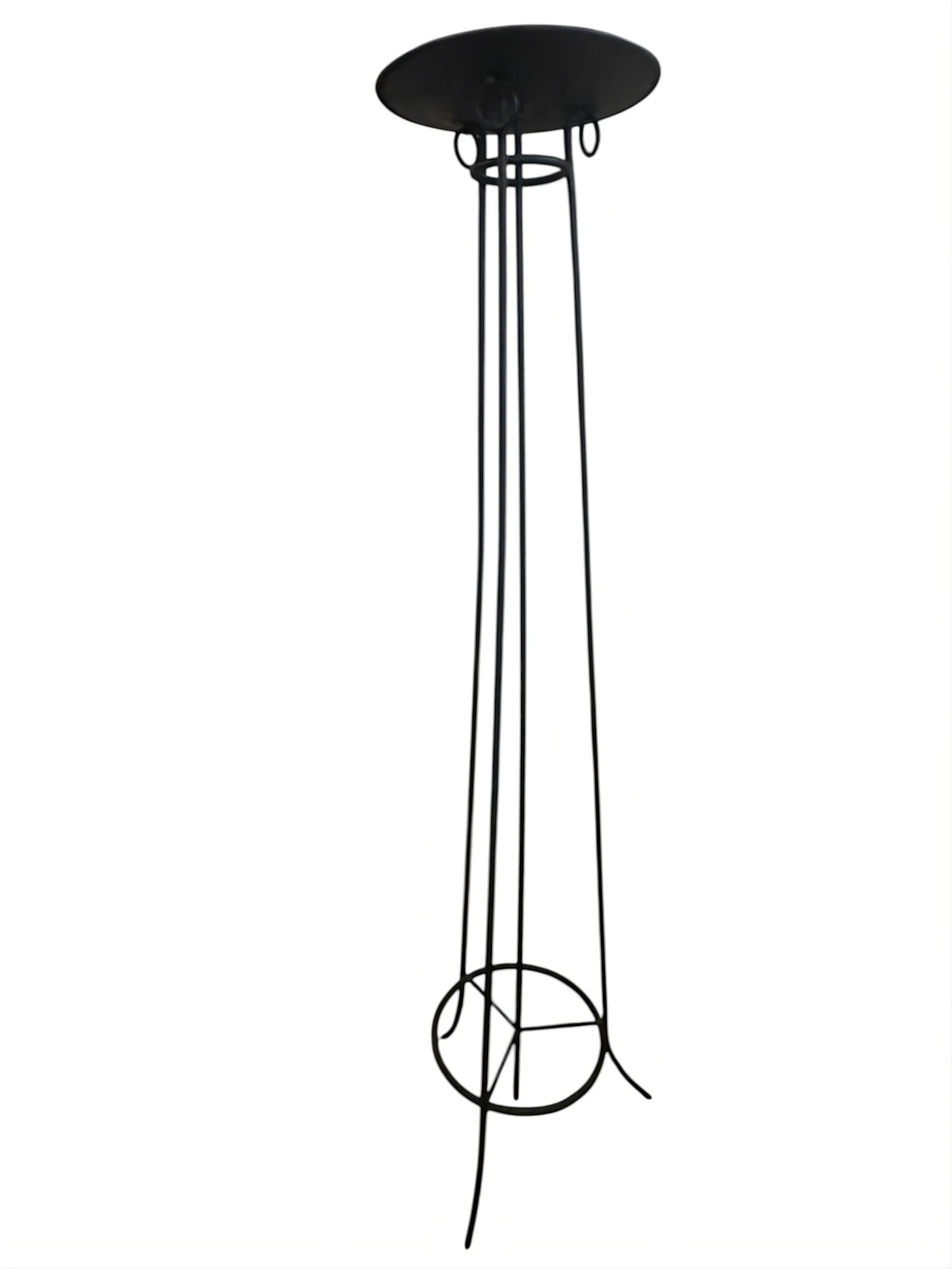 Four elegant antique floor lamps in a bright setting.