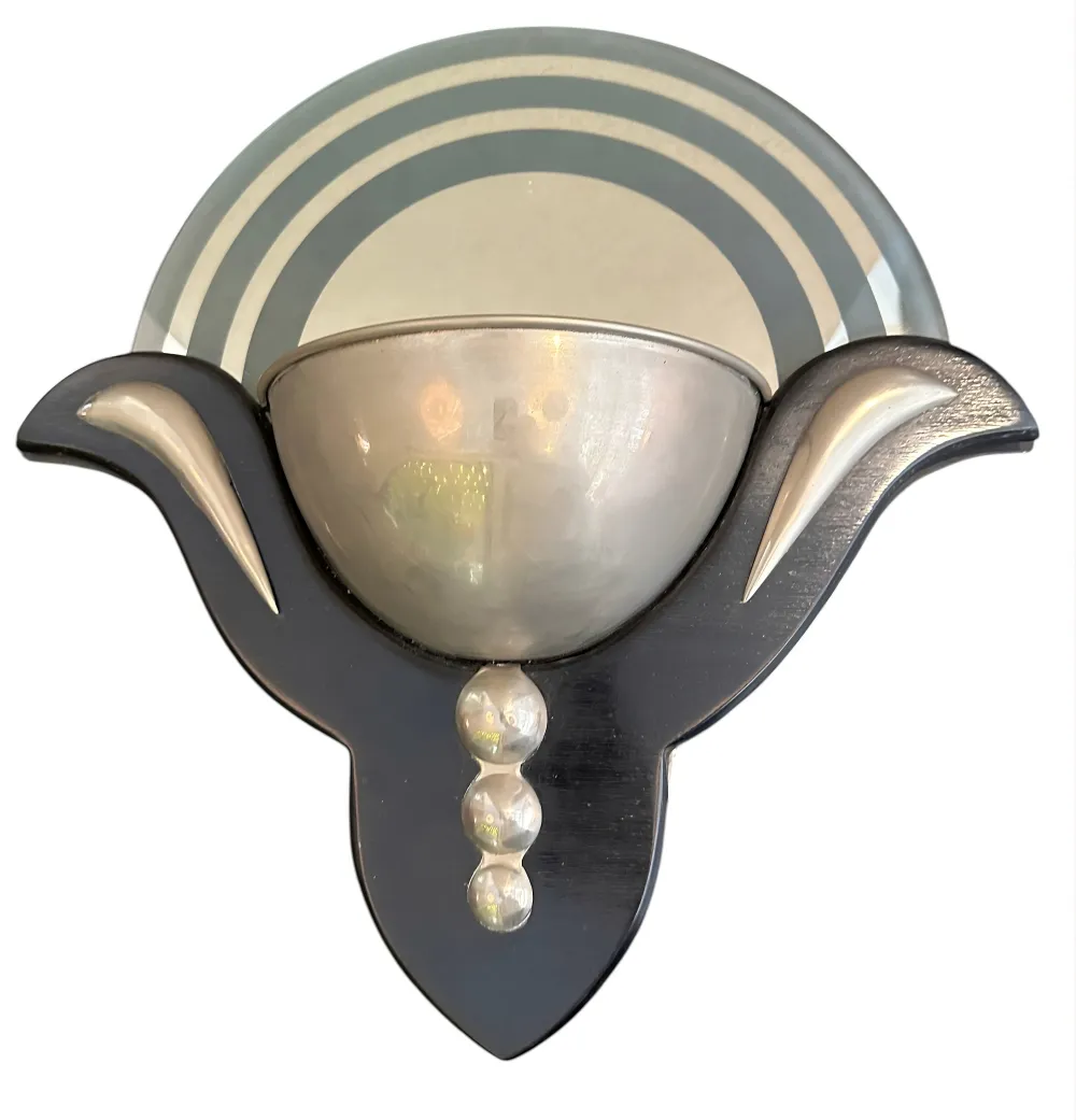 antique pair of sconces with curved design in an elegant setting