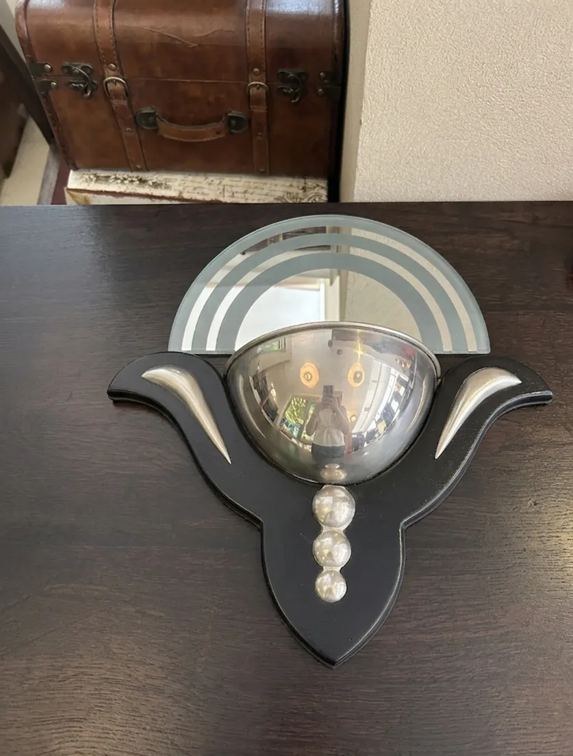 Antique sconce with modern details and mirror