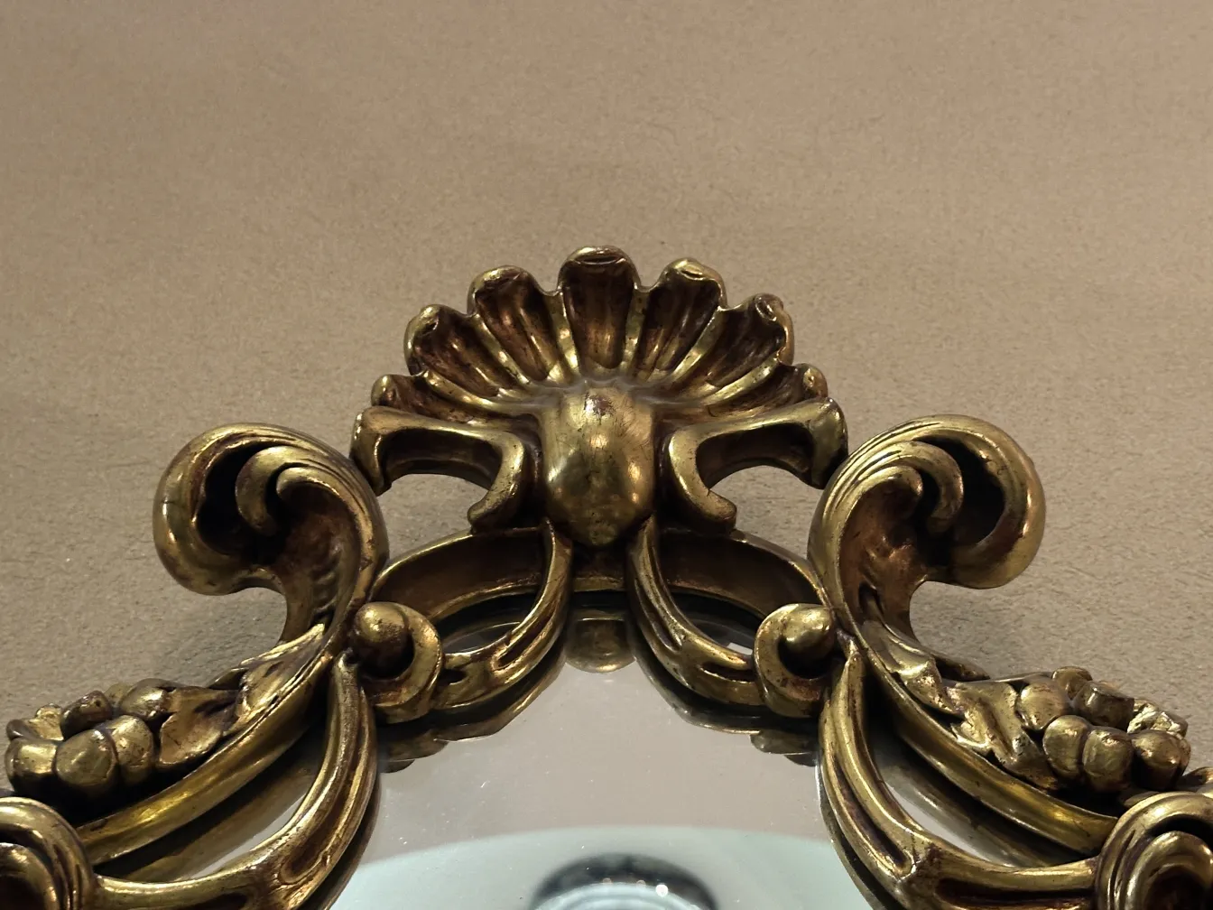 antique mirror with detailed decorative frame