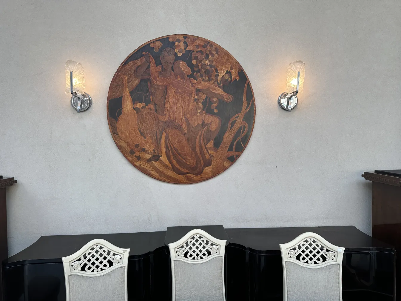 Details of antique marquetry on decorative wall.