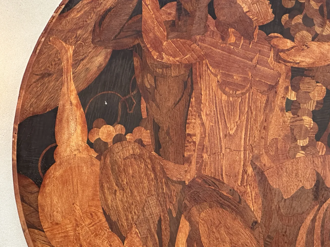 detail of antique marquetry featuring animal and fruit shapes