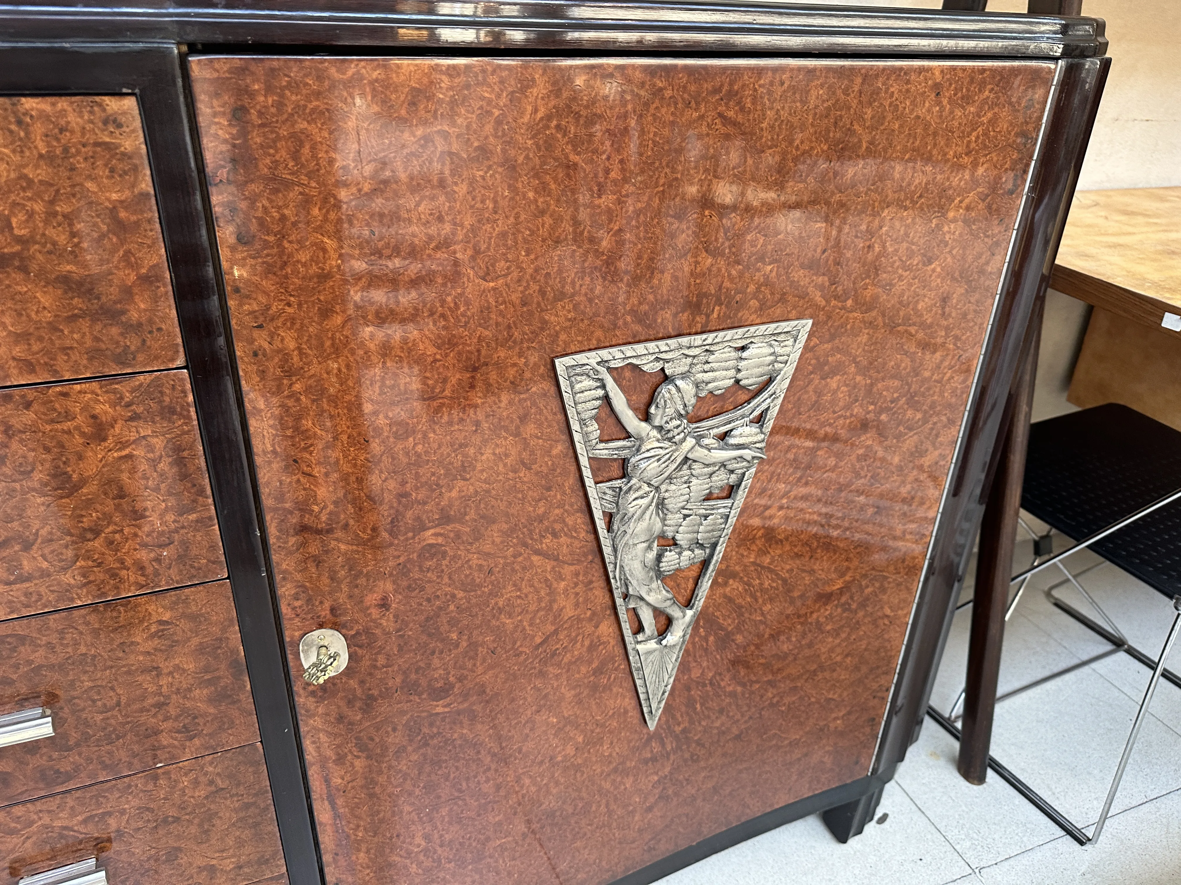 antique sideboard with artistic details on the front