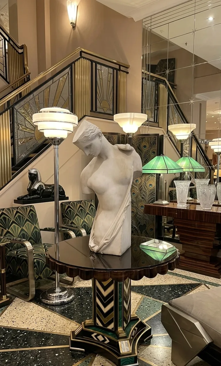 antique sculpture by Pietro Barzanti in an elegant setting with art deco decor