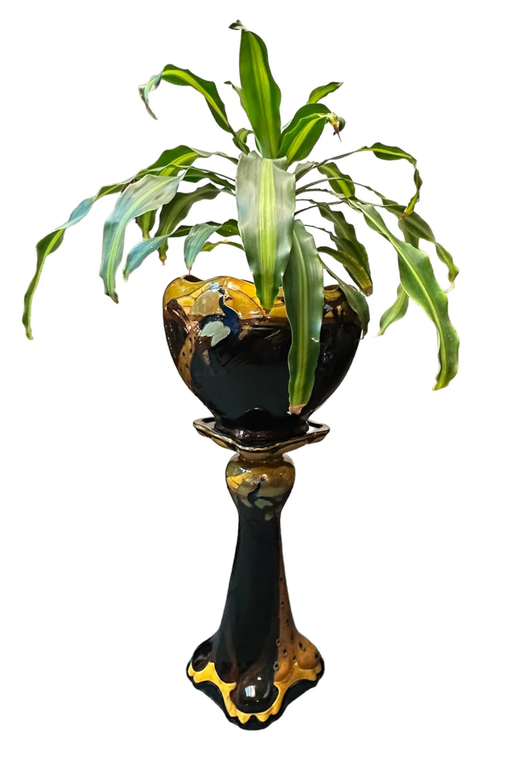 vase ancien en céramique décoratif avec des feuilles vertes