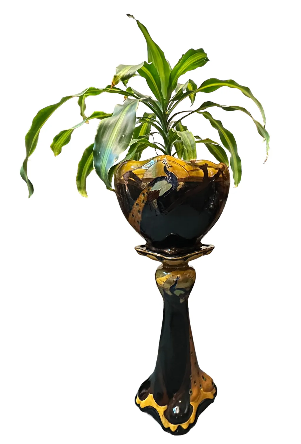 antique decorative planter with green plants and artistic design