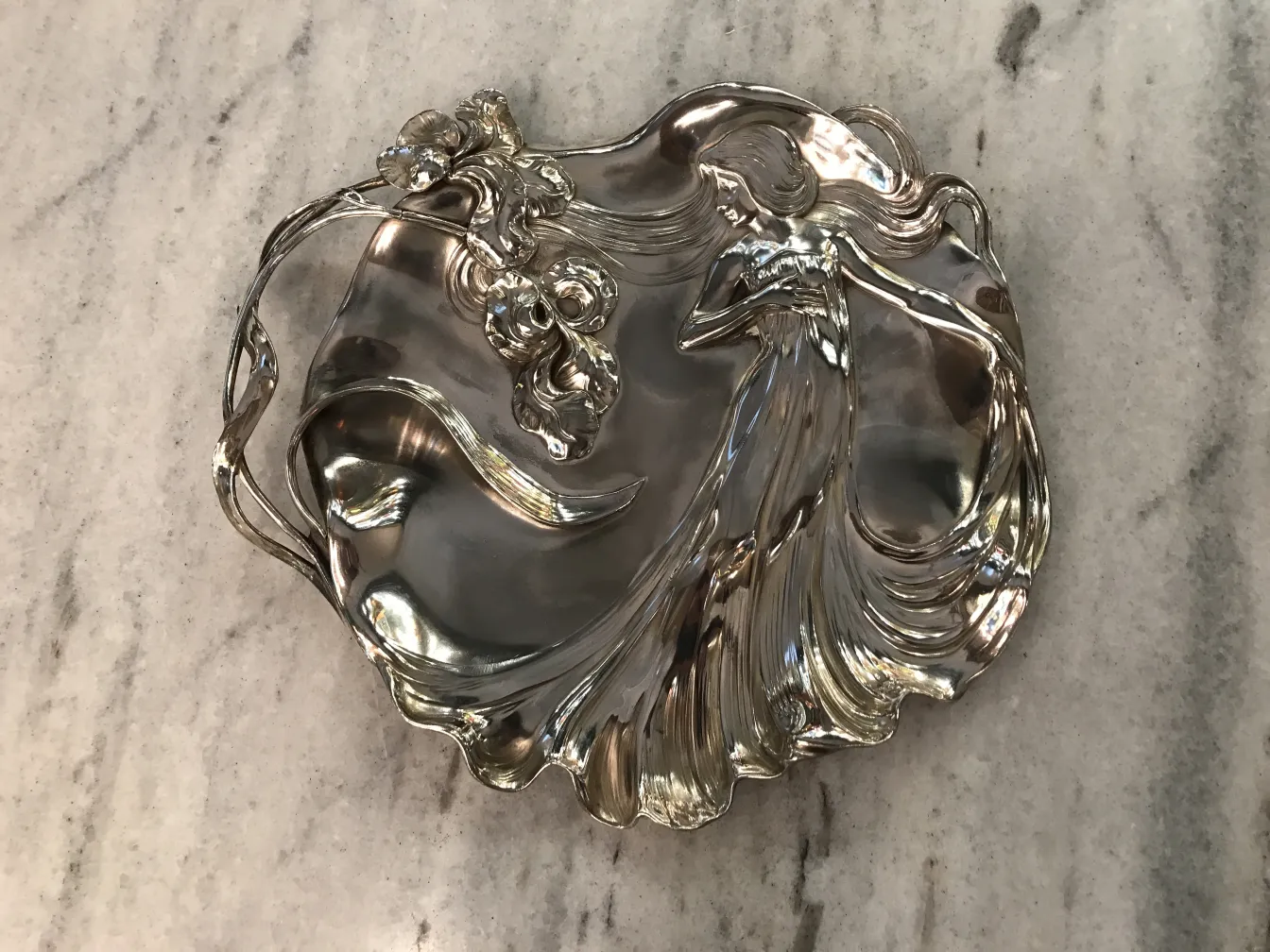 antique wmF card tray with floral design and figure