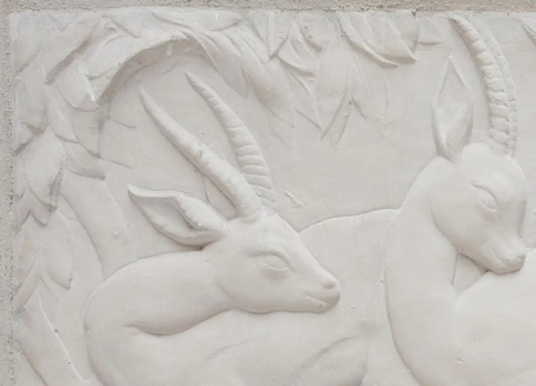 antique wall plate with animal reliefs in a natural setting