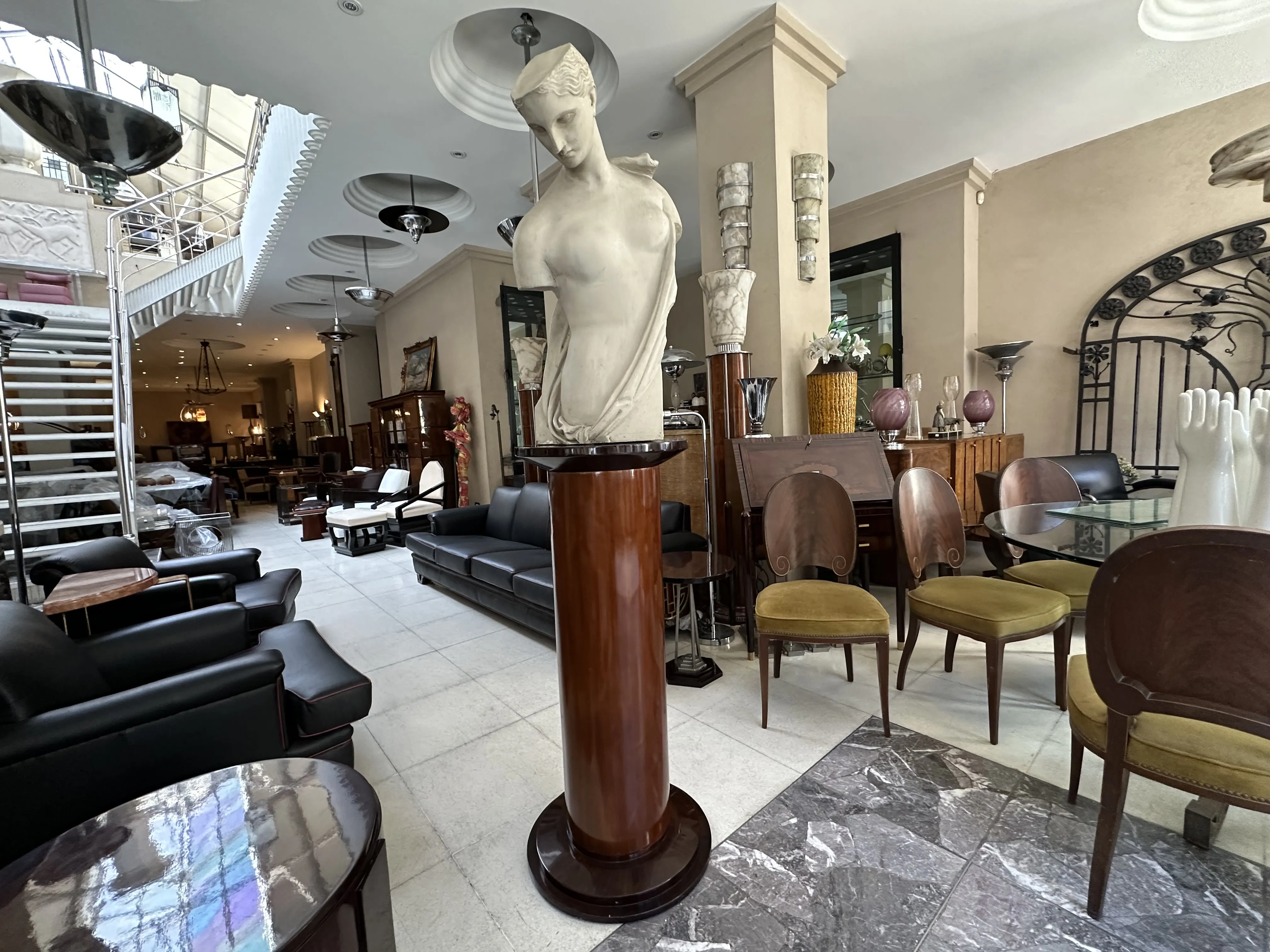 elegant white sculpture by Pietro Barzanti in an antique furniture setting