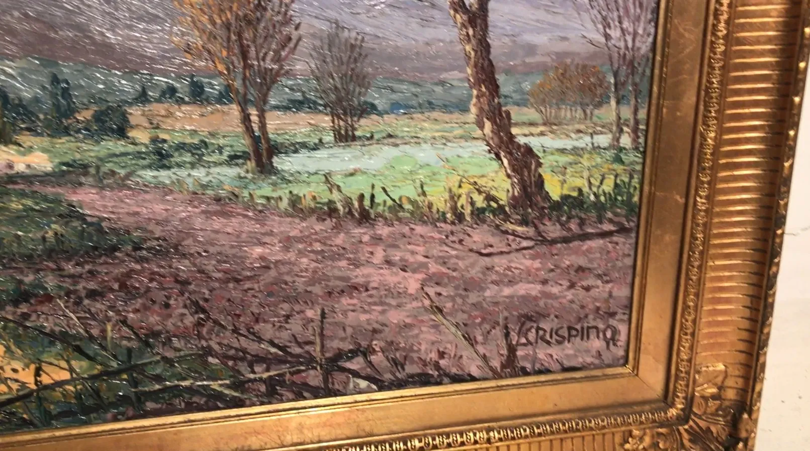 dipinto antico di un paesaggio con alberi e cielo grigio