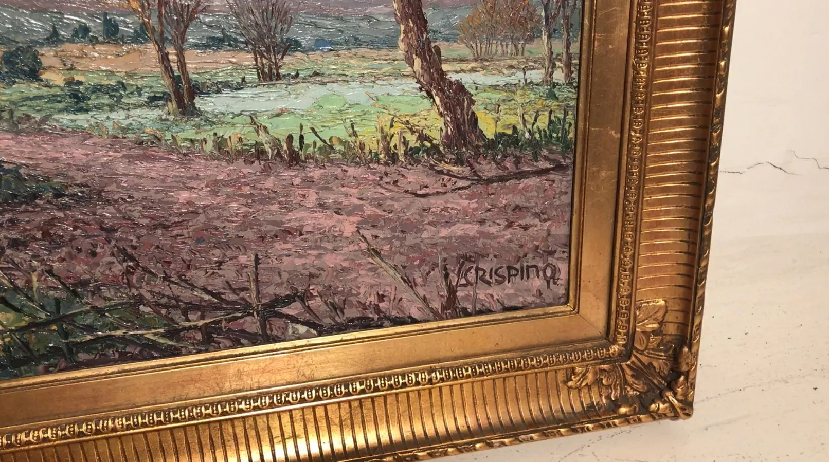 Pintura antigua de paisajes con árboles y campos en tonos suaves.