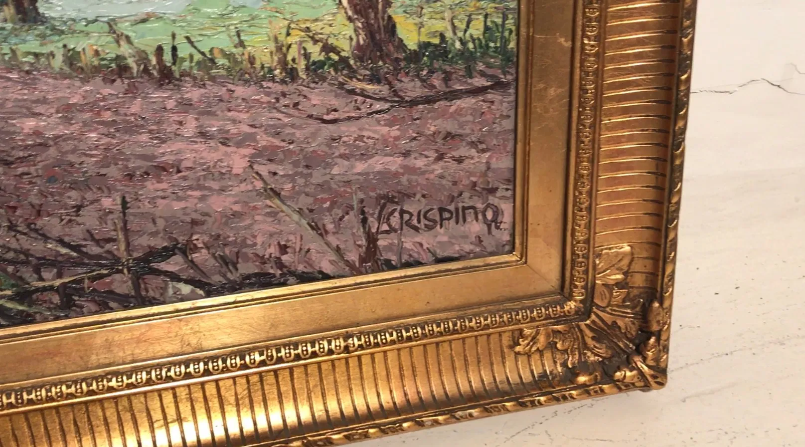 Pintura antigua de Luis Crispino, enmarcada en dorado.