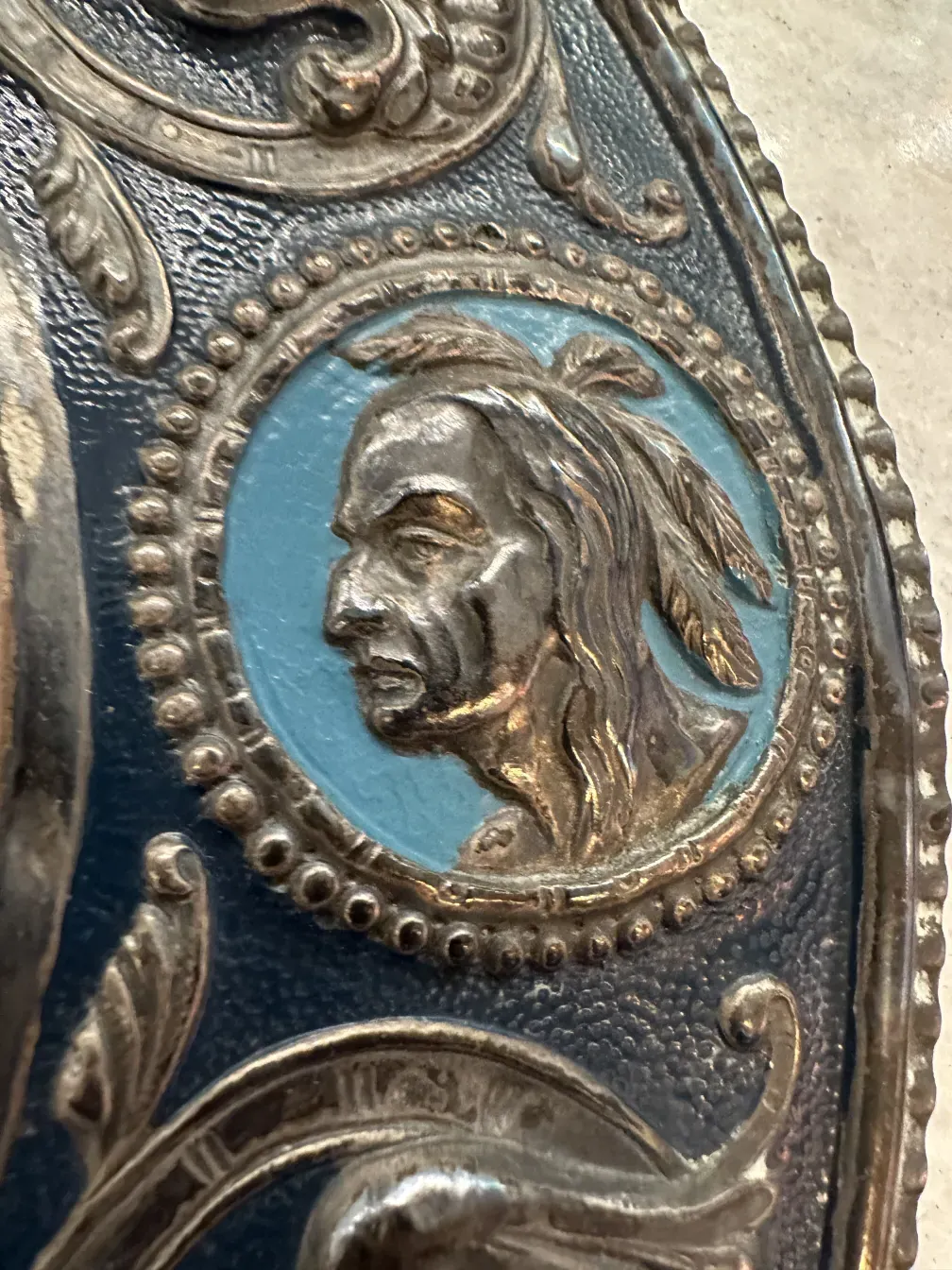 detail of antique wall plate with portrait