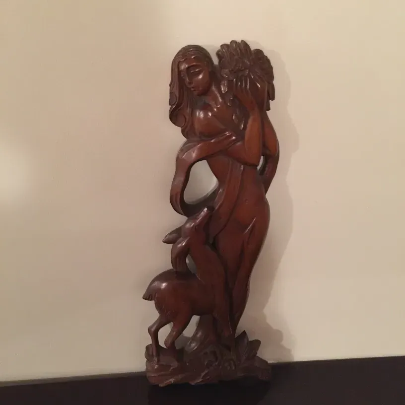 antique wall plate featuring relief details and figures