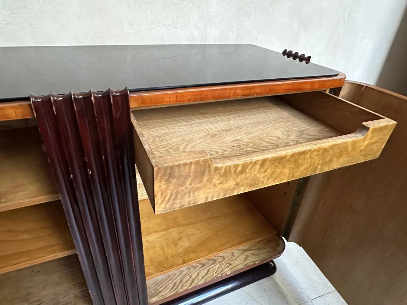 Art deco sideboard with open drawer and unique lines