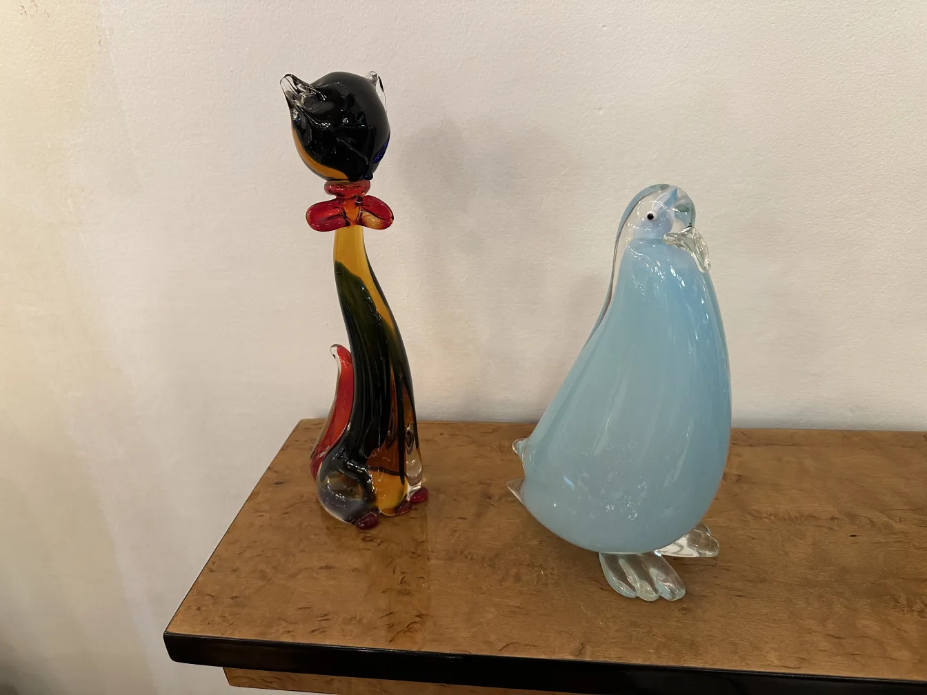 Murano sculpture depicting an animal with soft colors and a stylized shape.