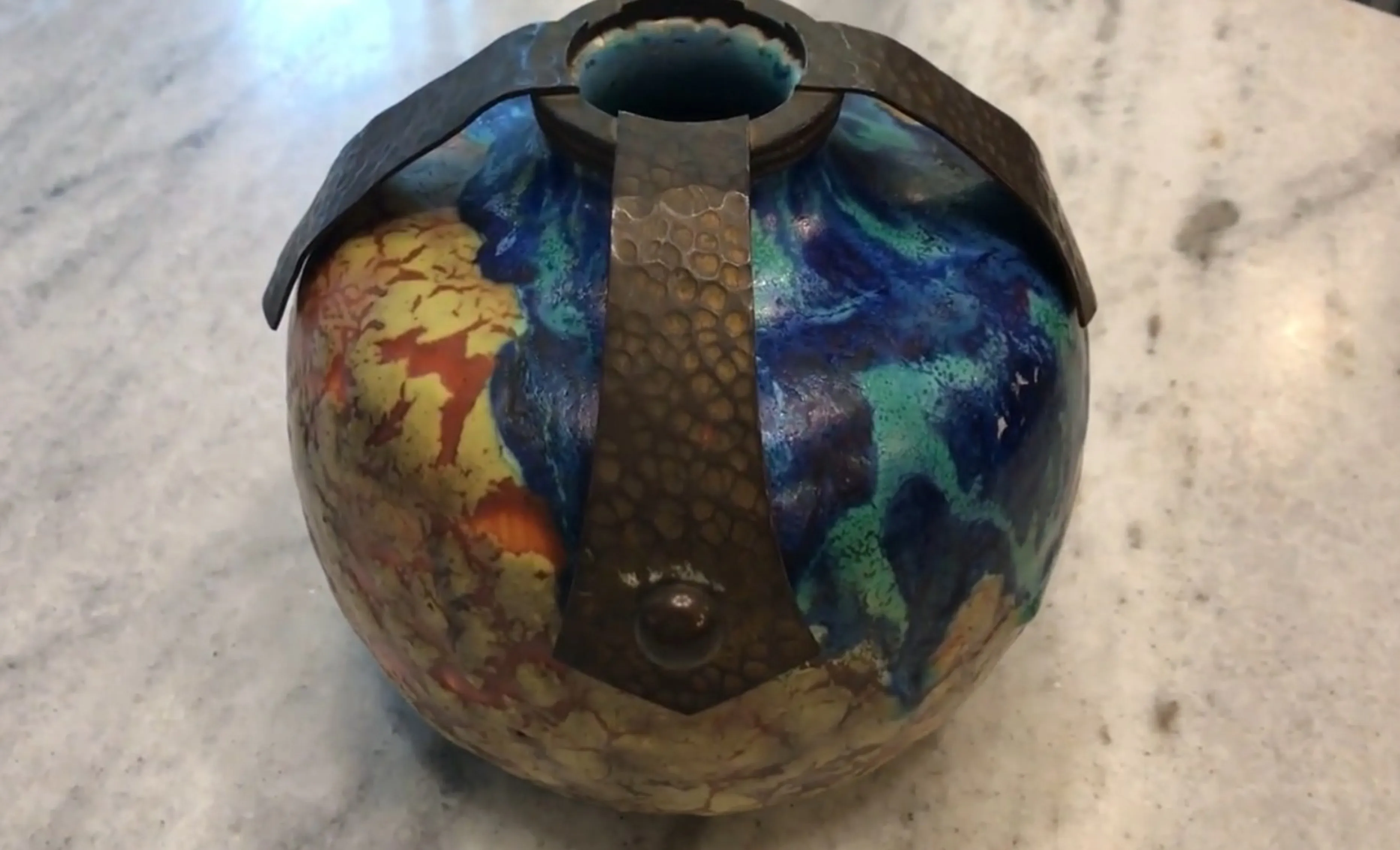 Antique ceramic vase with multicolored glaze and metal details