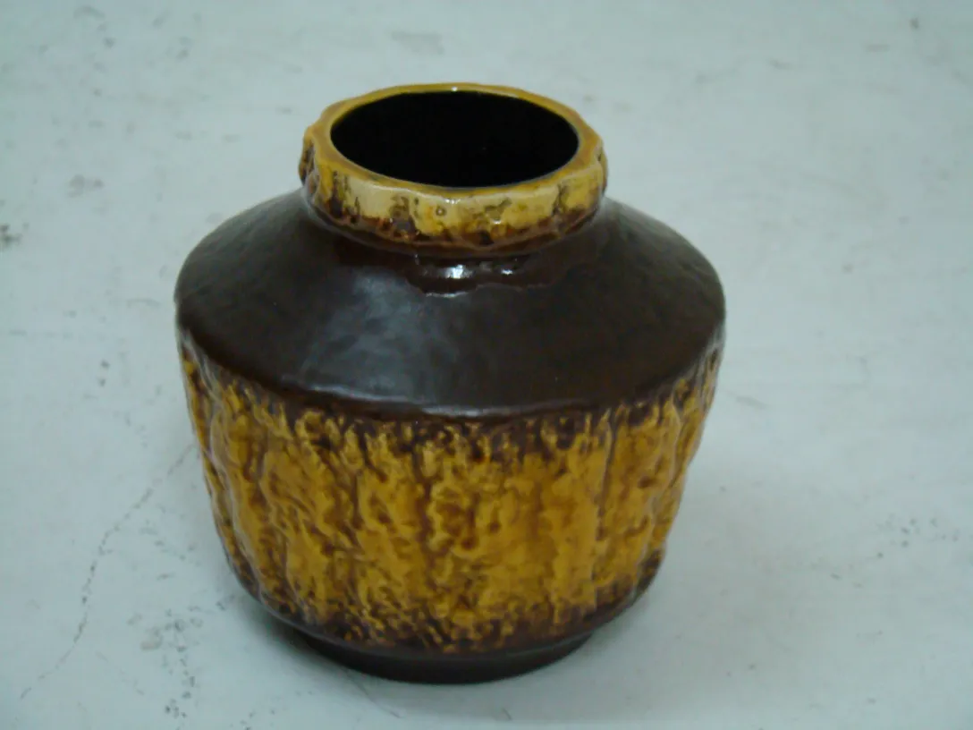 Antique ceramic vase from Carstens Tönnieshof in brown and yellow tones.