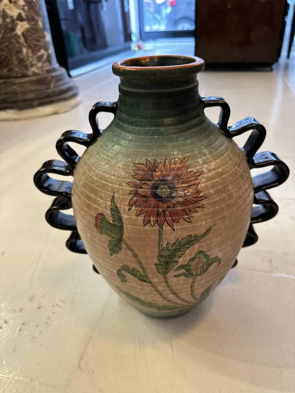 Antique Deruta ceramic vase with colorful floral design.