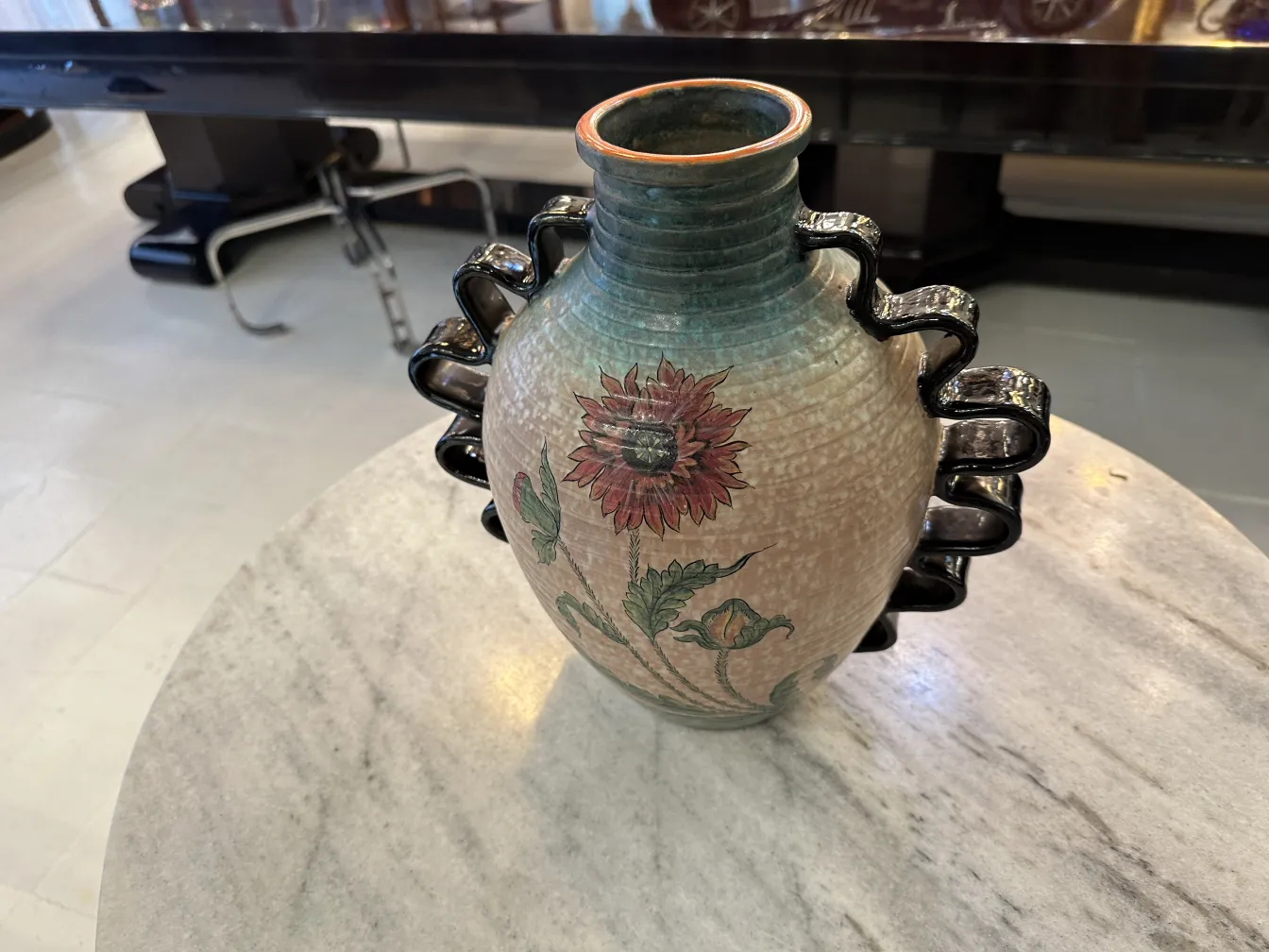 Antique Deruta ceramic vase with colorful floral design.