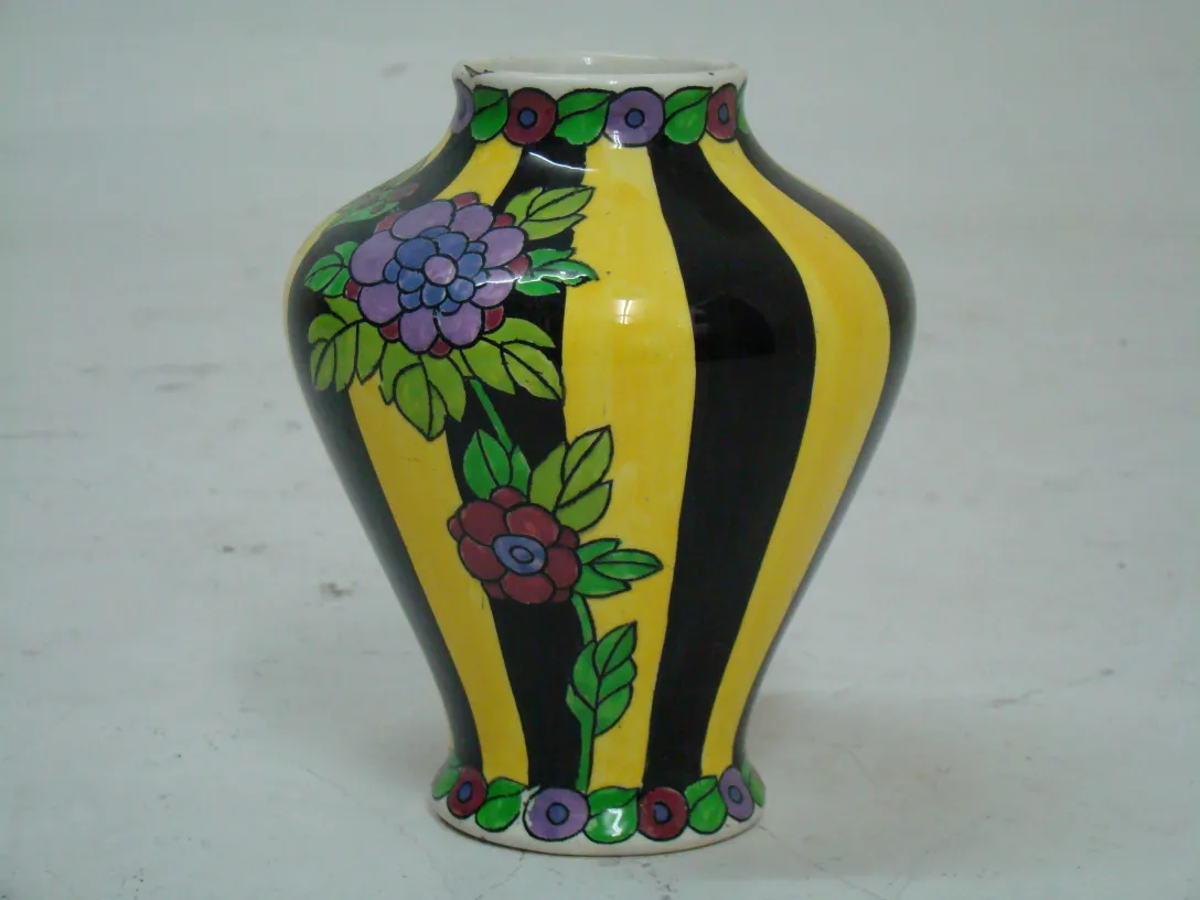 Antique Boch Frères Keramis ceramic vase with vibrant colors and floral designs