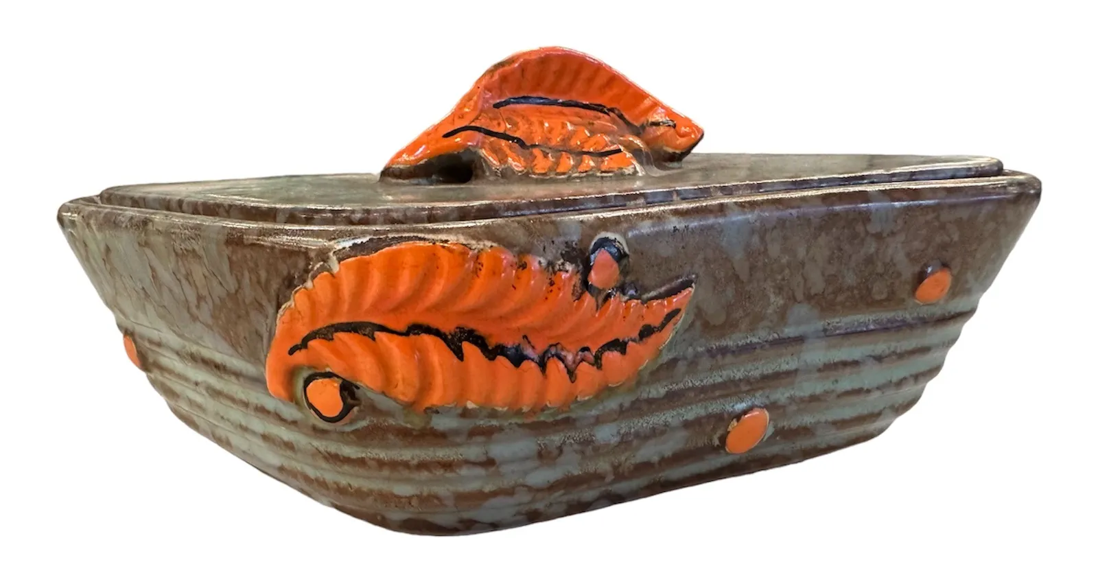 Ceramica antigua decorada con hojas en tonos naranja y marrón