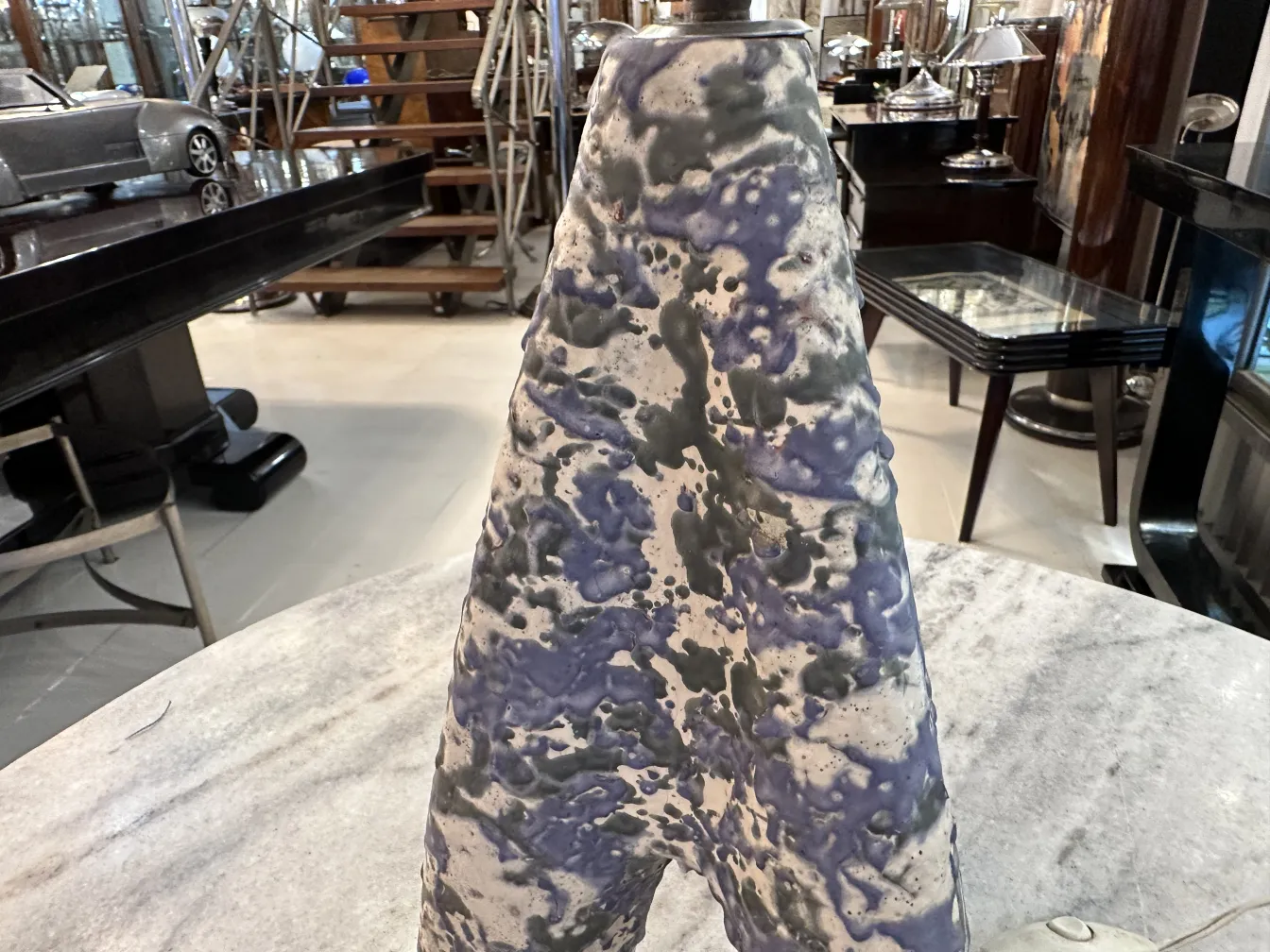 Antique table lamp with colorful design in a cozy setting