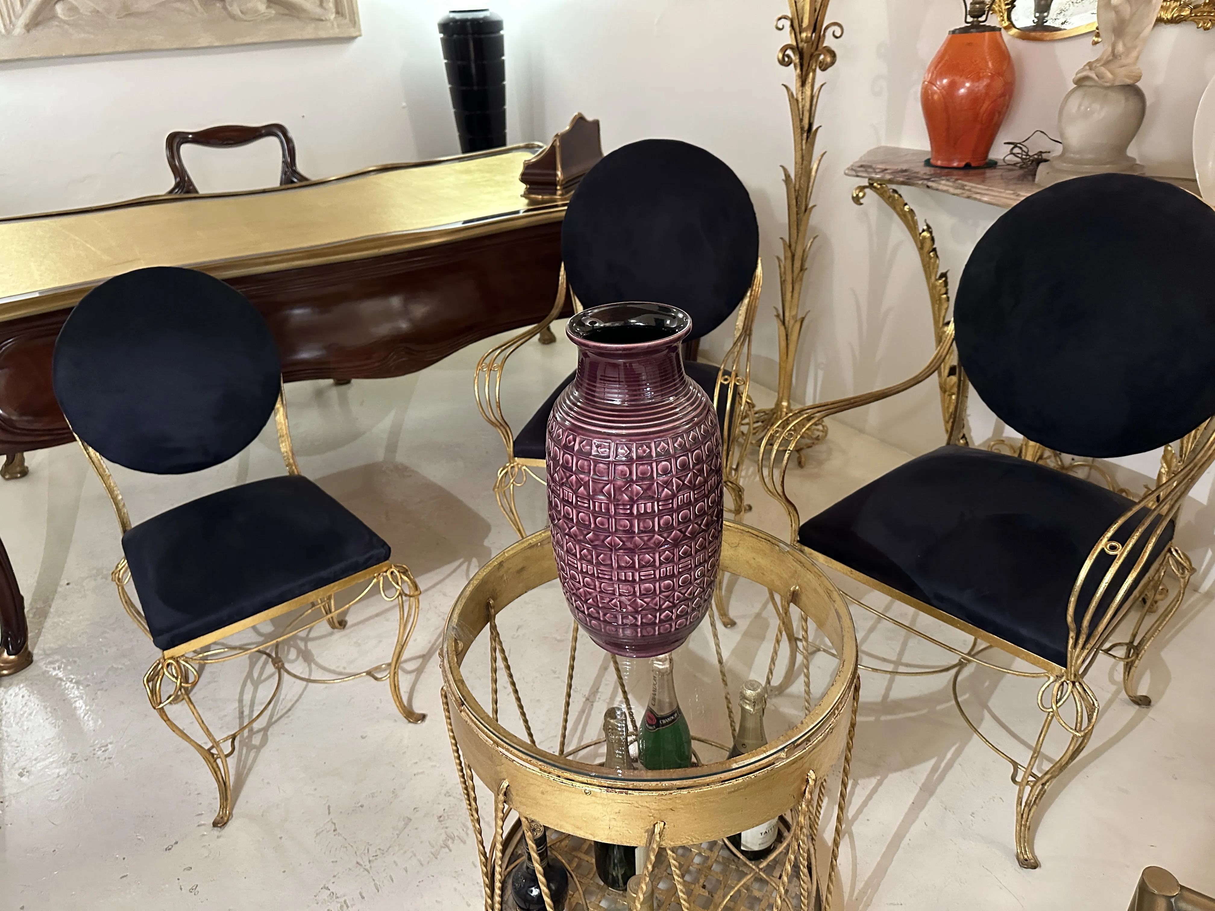 Decorative antique ceramic vase with purple pattern in an elegant setting.