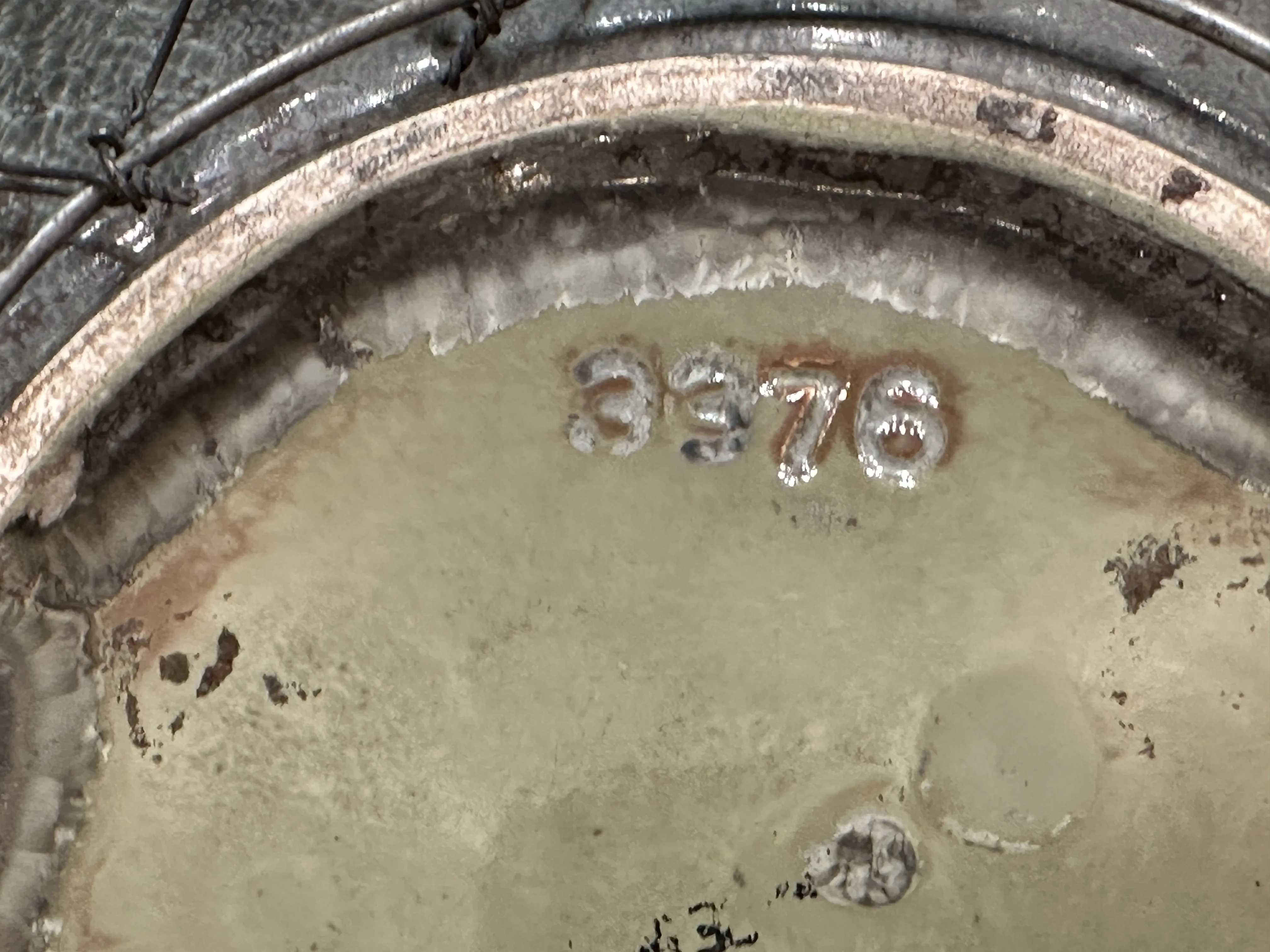 Detail of an antique ceramic with glaze and design