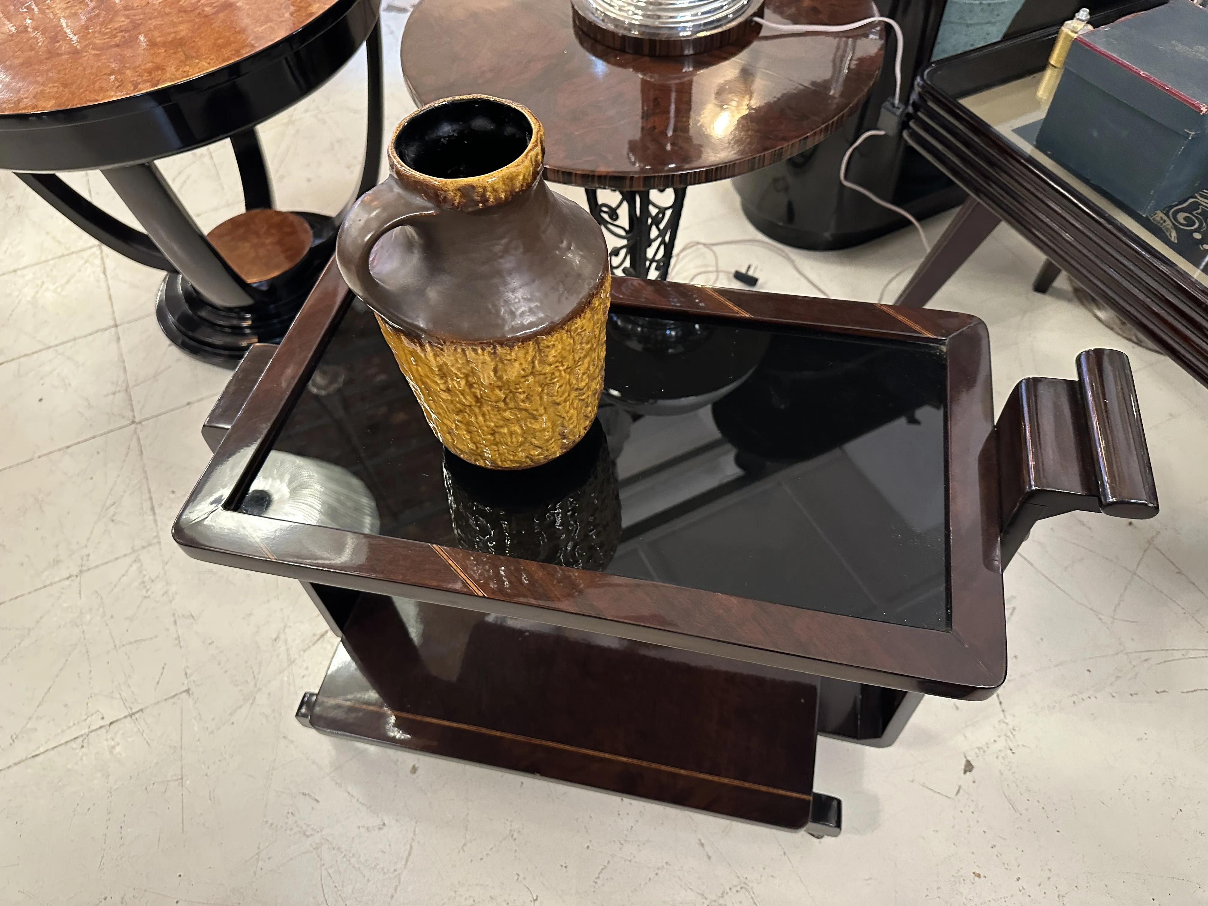 Decorative antique ceramic with yellow and brown details in an antique setting.