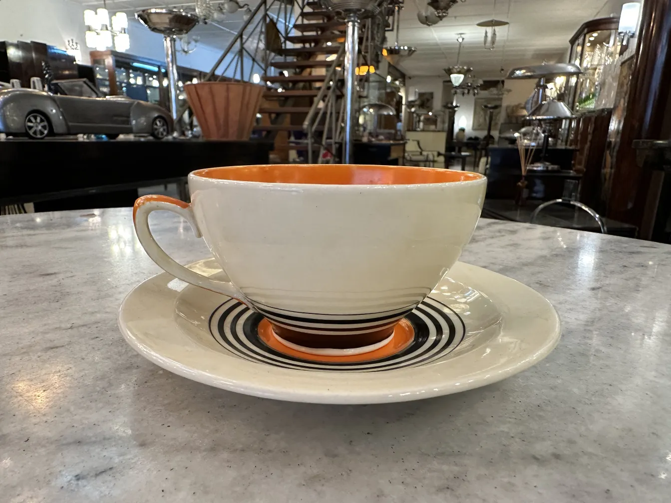 Antique tea set by Susie Cooper with colorful plates and cups